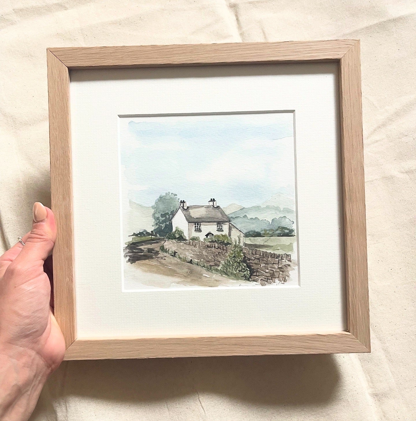 'White Cottage in the Lakes' Framed.